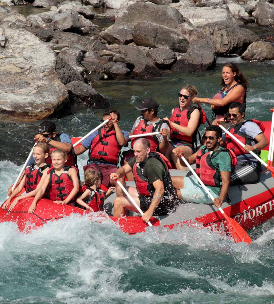 Group of people of all ages on a whitewater rafting trip.